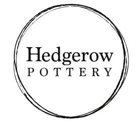 The original Hedgerow Pottery logo: a hand-drawn circle enclosing the words Hedgerow Pottery, at small size and low resolution.